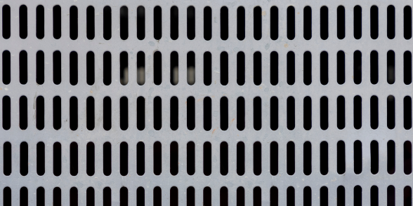 Orange steel grating floor deck with open grid pattern